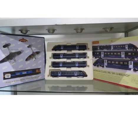 A boxed Hornby 00 gauge Hitachi Class 395 Sir Chris Hoy set and a Pride of Britain Capt Tom Moore Bachmann boxed set, both un
