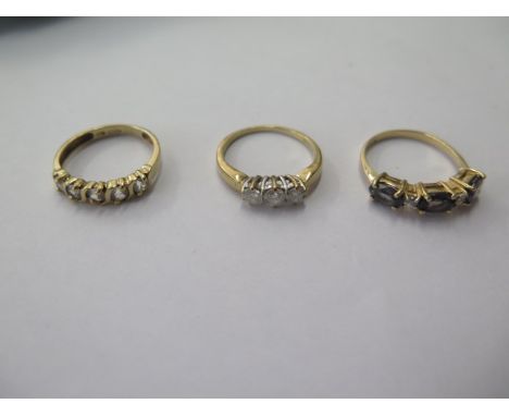 Two 9ct gold rings, size J/K and a 10ct ring size K, total approx 5 grams, 3 stone ring is set with small diamonds 