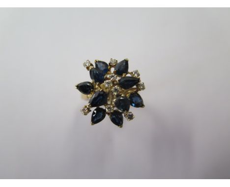 A 14ct yellow gold sapphire and diamond cluster ring, size M/N, head approx 20mm wide, approx 6.4 grams, in good condition 