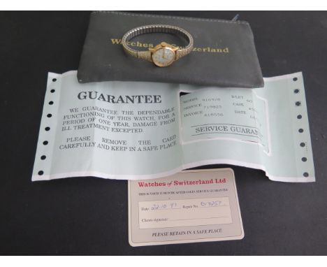 A 9ct yellow gold Rolex ladies 9169/8 manual wind wristwatch, 20mm case, on an associated sprung strap with Rolex service sli