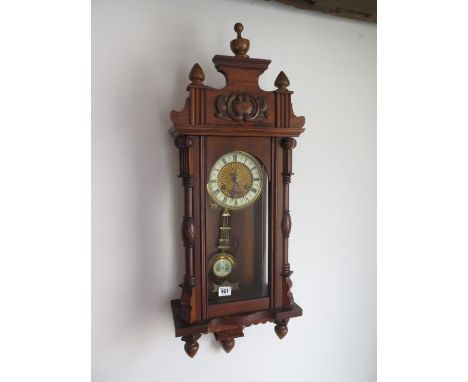 An 8 day walnut case Austrian wall clock, 85cm tall, running 