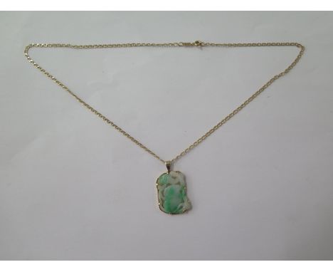 A gilt metal mounted jade pendant on a 14ct yellow gold chain, 48cm long, total weight approx 9 grams, in good condition 
