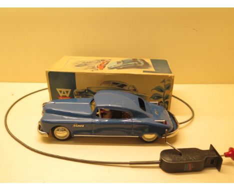 An Arnold Primal tin plate car, 26cm long with steering cable link, working but wind link not working, boxed, some light wear