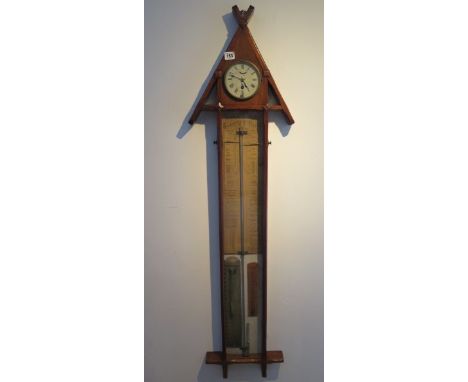 An oak Admiral Fitzroy barometer with clock and  thermometer, 130cm tall, clock not currently running, some touching in to ba