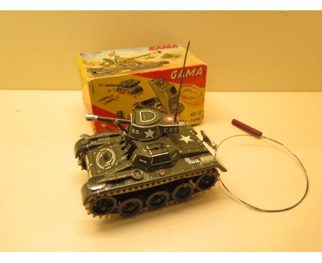 A Gama tinplate clockwork Montage - Tank, 16cm long, boxed, motor runs, guns action, track does not catch to propel, minor we