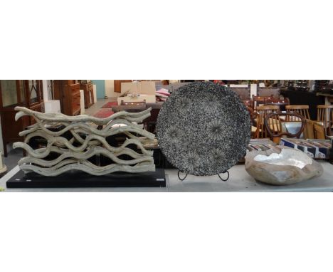 Modern driftwood sculpture on rectangular base together with a shell design charger and another probably driftwood and mother
