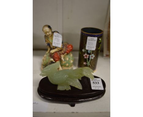 A carved jade bird, cloisonne brush pot and a satsuma figure.