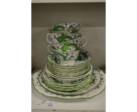 A Tuscan china part tea service painted in green with dragons.