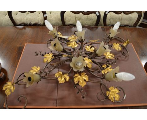 A decorative wrought iron light fitting.