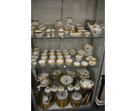A large comprehensive Royal Copenhagen service, gilt and floral decoration to include numerous plates, dishes, bowls and cove