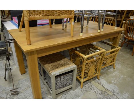 A modern light oak dining table.