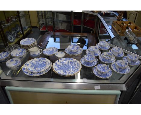 A Royal Worcester part tea service comprising numerous cups and saucers, serving plates, side plates etc all decorated with b