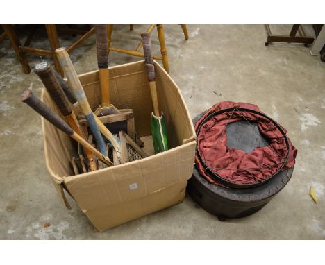 Old tennis racquets, a lantern and a circular hat box.