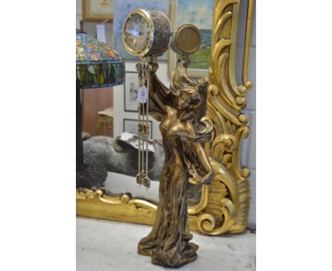 A decorative figural clock.
