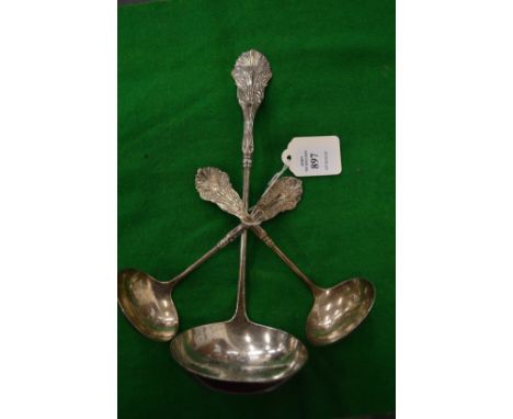 A sterling silver soup ladle and pair of matching sauce ladles.
