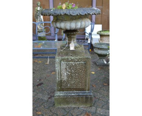 A good large classical garden planter on a square pedestal base.