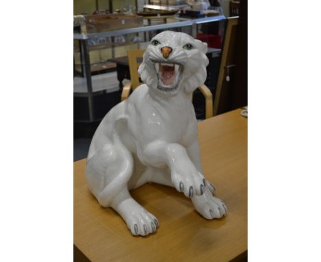 A large white glazed pottery model of a tiger.