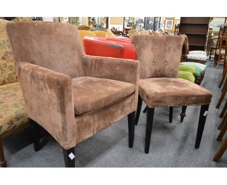 A modern upholstered small armchair and similar button back chair.