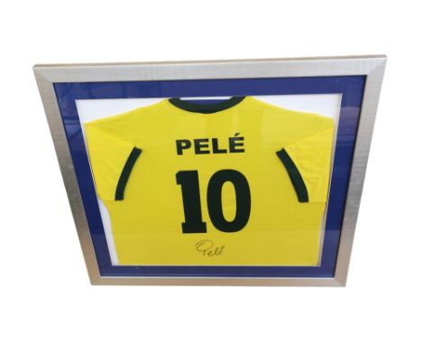 Brazil: A framed and glazed, signed yellow shirt printed 'Pele 10', signed by Pele. Frame measuring approx. 83cm x 73cm.