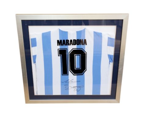 Argentina: A framed and glazed, signed Diego Maradona blue and white striped football shirt. Frame measuring approx. 83cm x 7