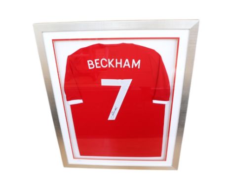 England: A framed and glazed, signed England away football shirt, signed by David Beckham, with 'Beckham 7' to the reverse. F