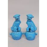 A PAIR OF CHINESE TURQUOISE GLAZED POTTERY TEMPLE LIONS, the bases with carved character mark,