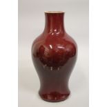 A LARGE CHINESE SANG DE BOUEF PORCELAIN BALUSTER VASE, 38cm high.