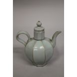 A CHINESE CELADON GLAZE PORCELAIN OCTAGONAL-FORM LIDDED TEAPOT, 19cm high.
