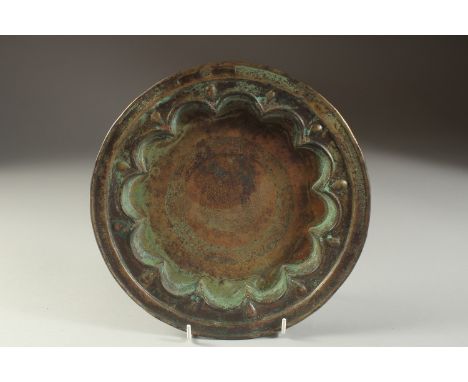A FINE 13TH CENTURY PERSIAN SELJUK ENGRAVED BRASS DISH, depicting a mythical creature in the centre and fine Kufic calligraph