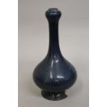 A CHINESE MONOCHROME BLUE GLAZED PORCELAIN GARLIC-HEAD VASE, 32cm high.