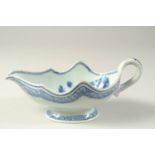 A 19TH CENTURY CHINESE BLUE AND WHITE PORCELAIN SAUCE BOAT, the interior decorated with flora, 23.