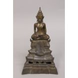 A LAO NORTH THAI BRONZE BUDDHA ON DETACHABLE STAND, 30cm high overall.