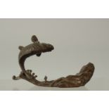 A BRONZE OKIMONO OF A CARP on a base of waves and a rocky mound, 12cm long.