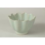 A TALL CHINESE CELADON GLAZED PETAL-FORM BOWL, 16cm diameter.