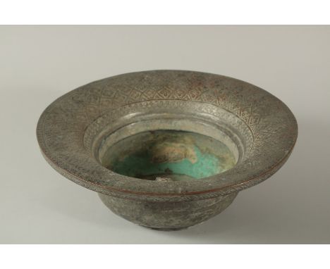 AN 18TH CENTURY OR EARLIER PERSIAN TINNED COPPER BASIN, 31.5cm diameter.