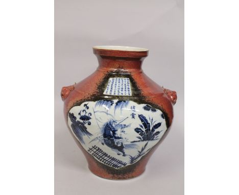 A LARGE CHINESE BULBOUS COPPER-RED BLUE AND WHITE PORCELAIN VASE, with moulded twin handles, painted with a panel of a warrio
