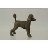 A BRONZE OKIMONO OF A DOG, 5cm long.