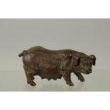 A BRONZE OKIMONO OF A SOW, 7.5cm long.