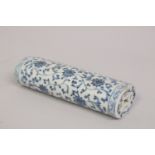 A CHINESE BLUE AND WHITE PORCELAIN WRIST REST, with lotus decoration and pierced ends, 15cm long.