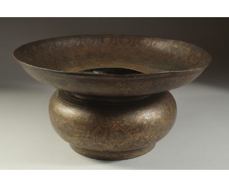 A FINE INDIAN BRASS OR BRONZE BASIN, with silvered floral motif decoration, 34cm diameter.
