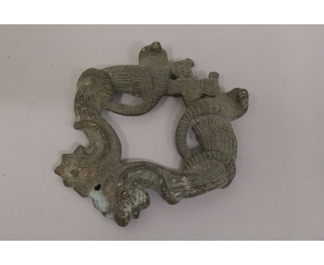 AN 18TH-19TH CENTURY INDIAN BRASS OR BRONZE DOOR KNOCKER, depicting birds and cobras, 10cm x 10cm.