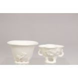 TWO DEHUA PORCELAIN LIBATION CUPS, largest 9cm wide.
