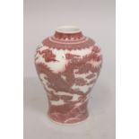A CHINESE UNDERGLAZE RED AND WHITE PORCELAIN DRAGON VASE, with six-character mark to base, 16cm