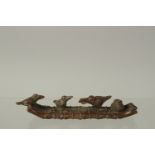 A BRONZE OKIMONO OF THREE OSPREY on a bamboo raft, 10cm long.