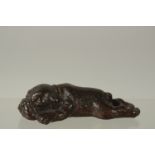 A BRONZE OKIMONO OF A SLEEPING DOG, 9.5cm long.
