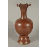 A CHINESE BROWN GLAZE PORCELAIN VASE, with petal-form rim, 32cm high.