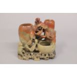 A CHINESE CARVED SOAPSTONE GROUP, depicting monkeys, 15.5cm high.
