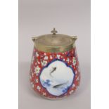 A JAPANESE NISHIKIDE WARE PORCELAIN JAR, with metal mounted lid and handle, painted with panels of