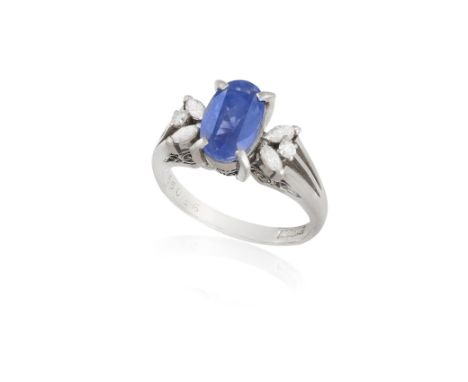 A SAPPHIRE AND DIAMOND DRESS RING, CIRCA 1960The oval-shaped sapphire weighing approximately 2.40cts within a four-claw setti