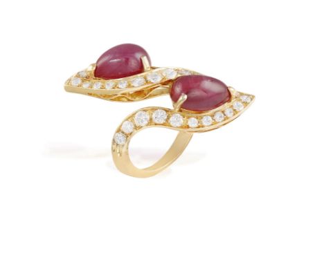 A RUBY AND DIAMOND 'TOI ET MOI' DRESS RING, BY PETOCHIOf crossover design, set with two pear-shaped cabochon rubies between g